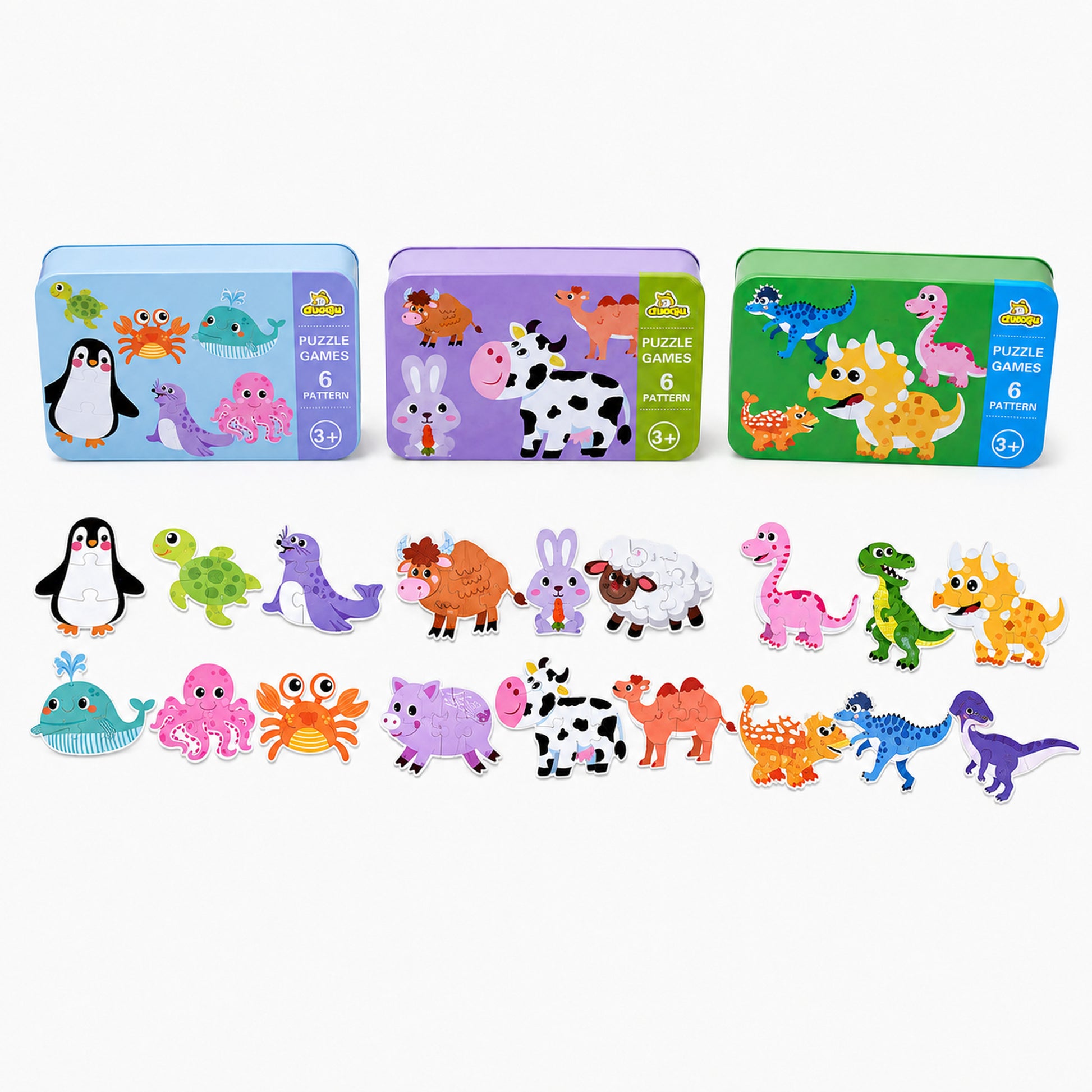 Los 18 rompecabezas del trío armados: 6 animales del mar, 6 del mundo y 6 dinosaurios, con sus tres estuches metálicos